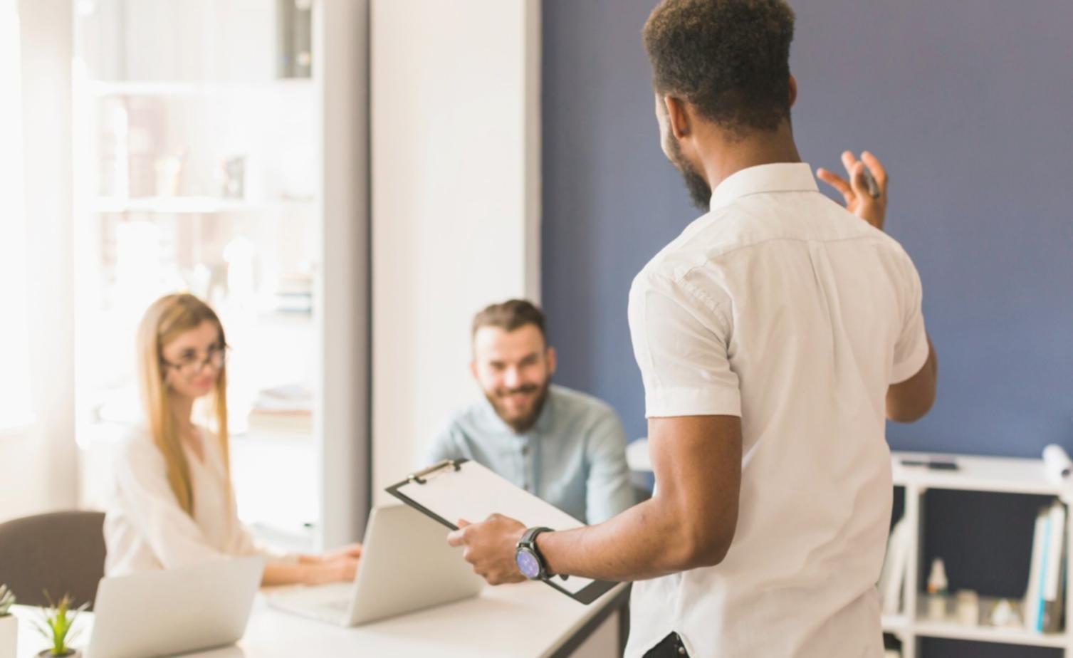Modern workspace with trading analysis and financial charts displayed on multiple screens